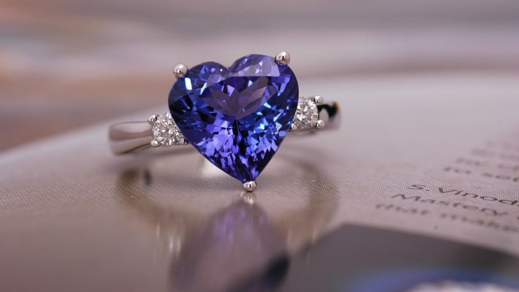 A close-up of a sapphire engagement ring