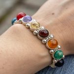 chakra healing bracelet worn on a person's wrist as a crystal for stress and anxiety relief.