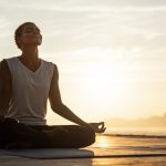 A woman practicing meditation & mindfulness